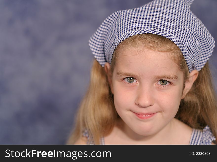 Shot of a cute little girl portrait on blue