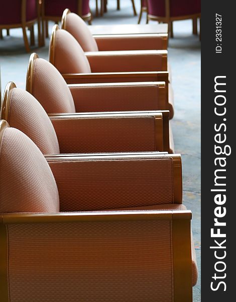 Row of cushion chairs in hotel lobby. Row of cushion chairs in hotel lobby