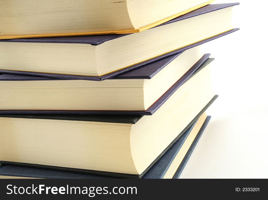 Stack of books against a white background