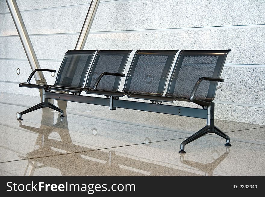 Empty chairs at an airport