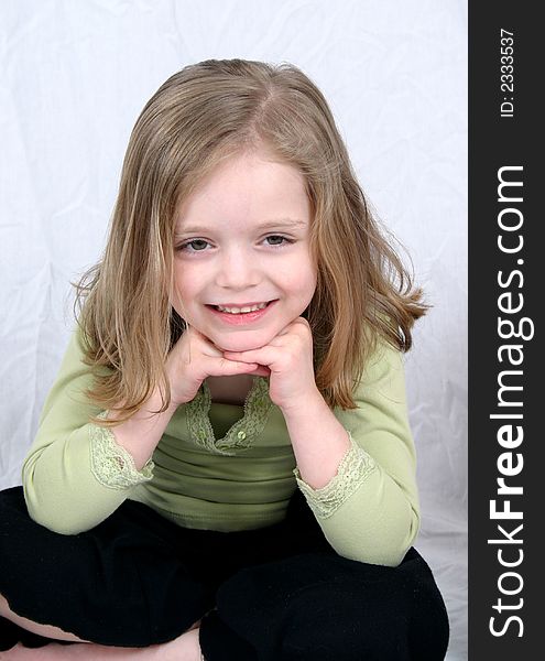 Little girl smiling on white background