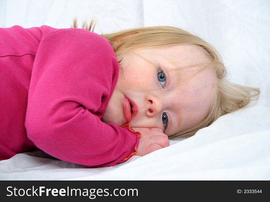 Cute little girl on a white background