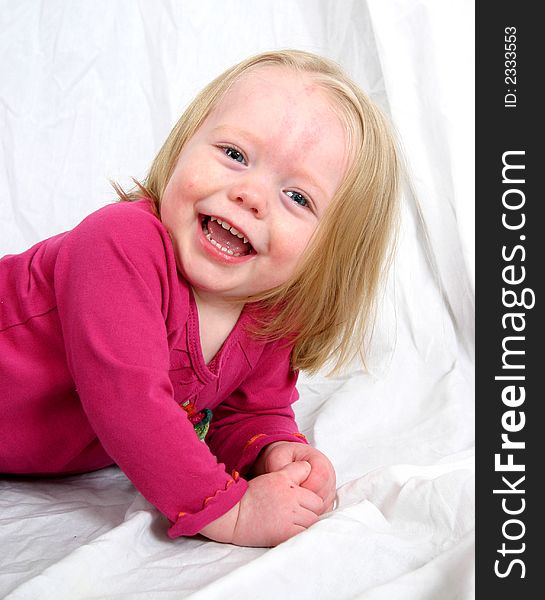 Cute little girl on a white background