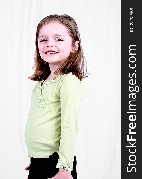 Cute little girl on a white background