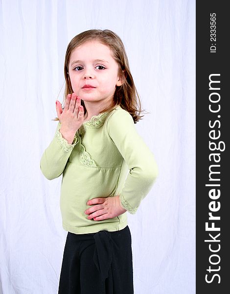 Cute little girl blowing a kiss. Cute little girl blowing a kiss