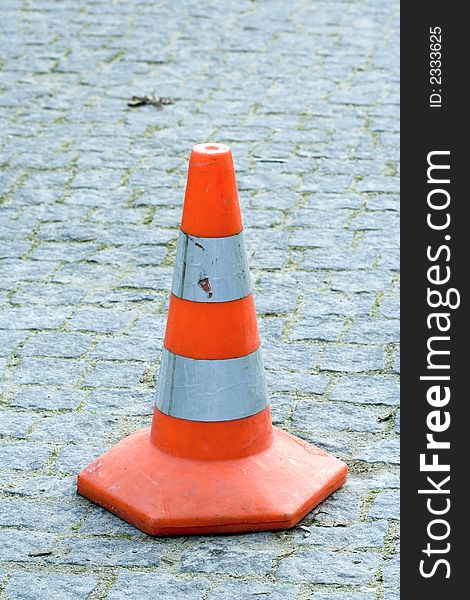 Orange traffic cone on the road