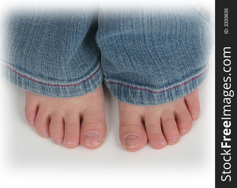 Close up of child's toes on a white background