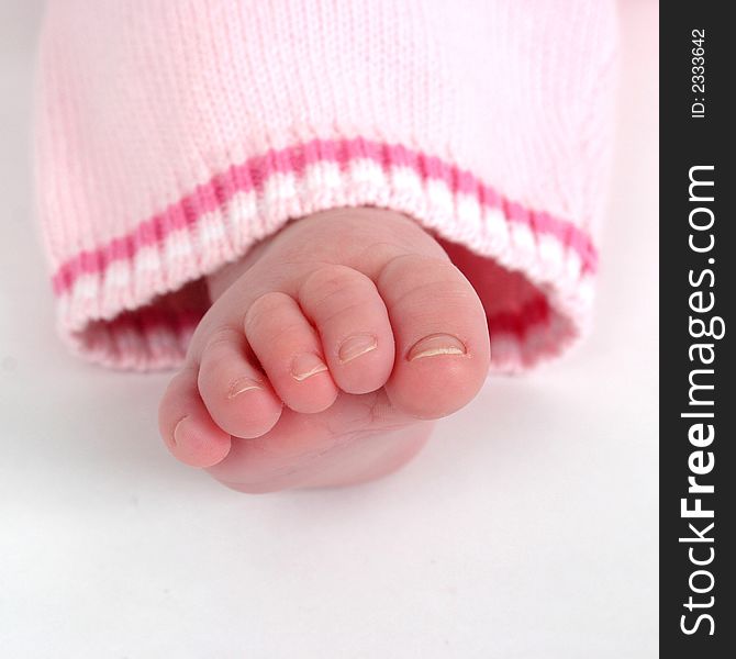 Close up of child's toes on a white background