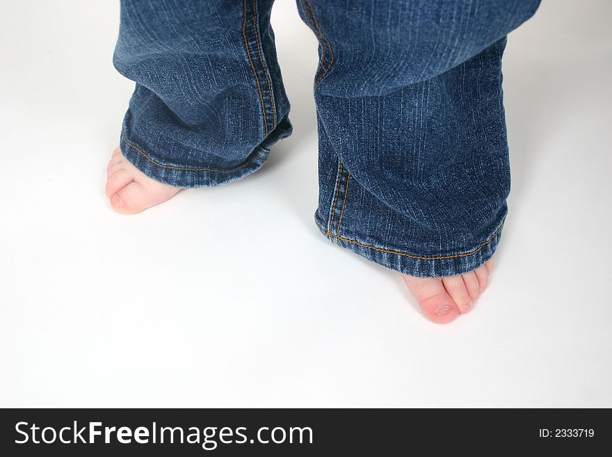 Close up of child's toes on white background