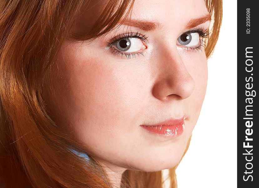 Close-up of a beautiful face of young woman with hair. Close-up of a beautiful face of young woman with hair