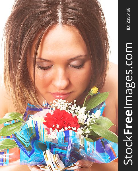 Close-up portrait of beautiful woman sniffing flowers isolated on white background