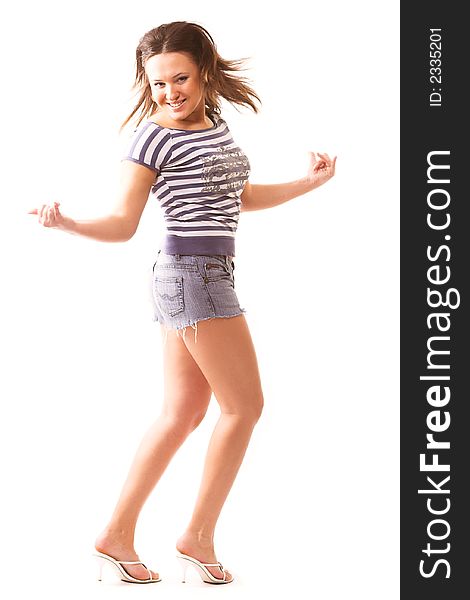 Dancing girl in sailor's jacket and shorts isolated on white background