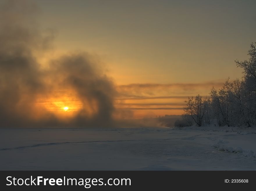 Foggy frosty morning on the river in Russia