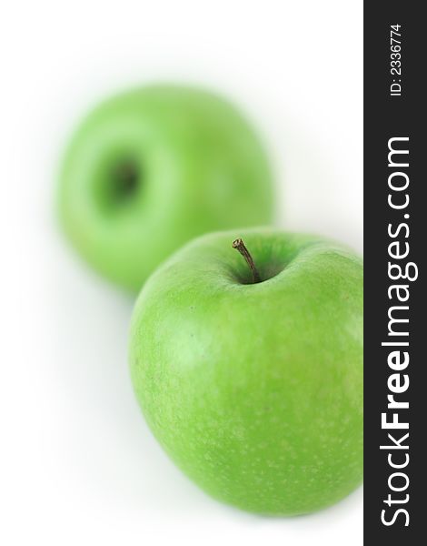 Couple of fresh green apples on white background