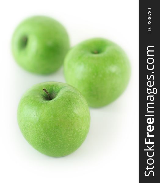 Some fresh green apples on white background