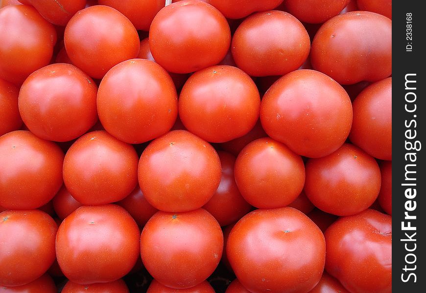 Big red tomatoes on the counter