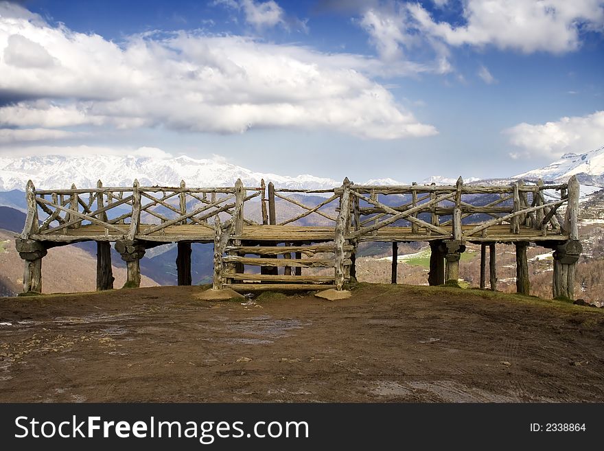 Viewpoint in a mountain gate in Cantabria. In the background is showed some snow covered mountains in a blue cloudy sky.