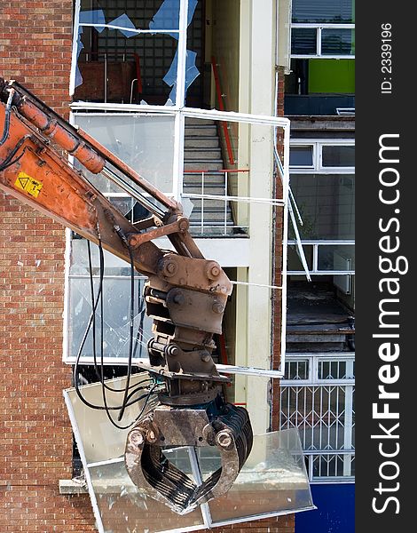 Demolition of a large window on a stairwell. Demolition of a large window on a stairwell
