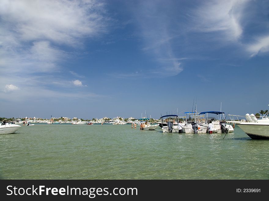 Groups of young boaters gather to drink, laugh and socialize off Peanut Island in West Palm Beach, FL