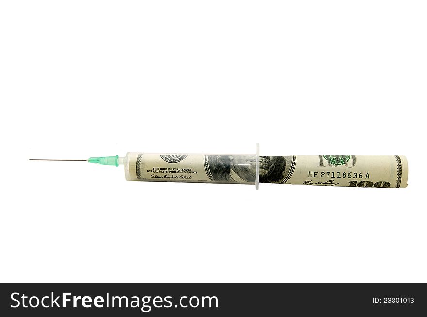 Syringe and the dollar on a white background