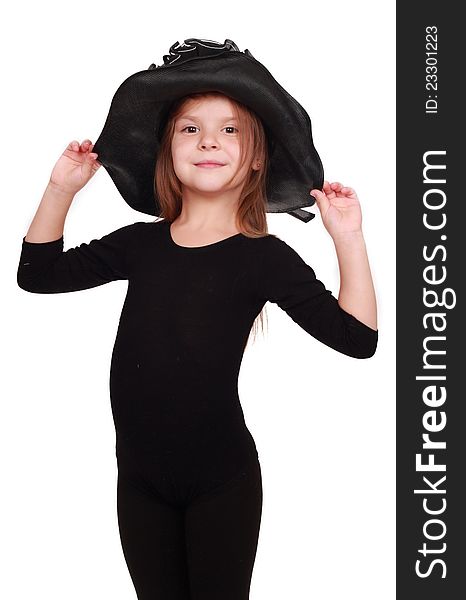 Cute little girl in a lovely black hat over white background. Cute little girl in a lovely black hat over white background