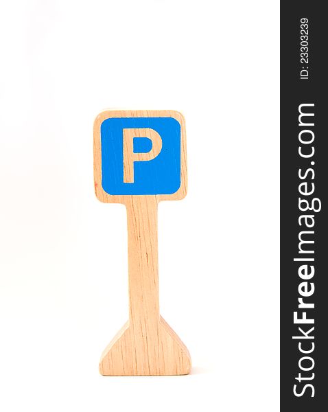Wooden toy made like parking sign on white background