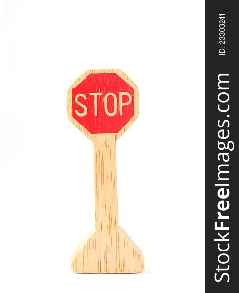 Wooden toy made like stop sign on white background