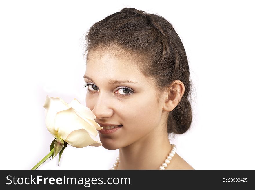 Young beautiful woman with rose  on a white background