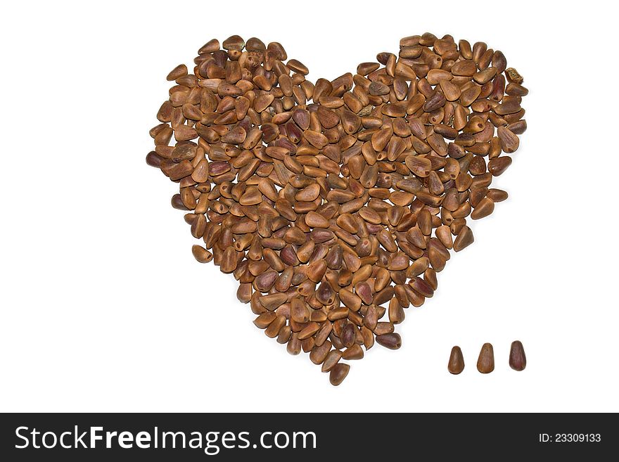 A close-up shot of unshelled pine nuts(heart-shaped). A close-up shot of unshelled pine nuts(heart-shaped)