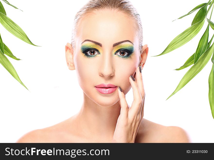 Beautiful blonde with artistic make- up and  bamboo leaves. Beautiful blonde with artistic make- up and  bamboo leaves