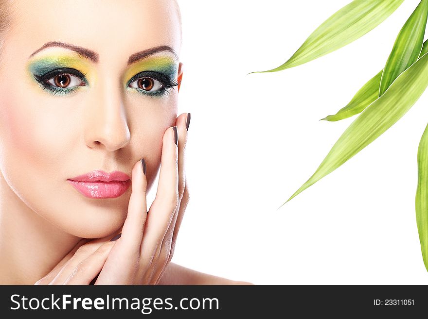 Beautiful blonde with artistic make- up and  bamboo leaves. Beautiful blonde with artistic make- up and  bamboo leaves