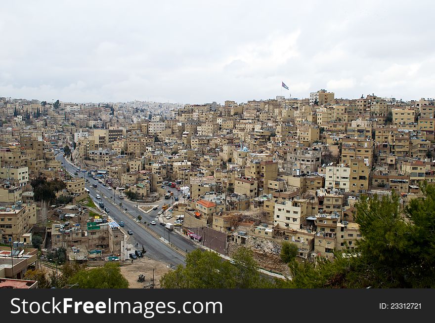 Cloudy day in Amman,Jordan with a flag ahead. Cloudy day in Amman,Jordan with a flag ahead