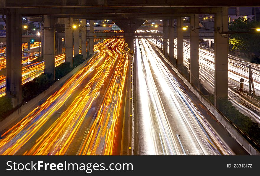 Lights on at night. In the city the car is running. Lights on at night. In the city the car is running.