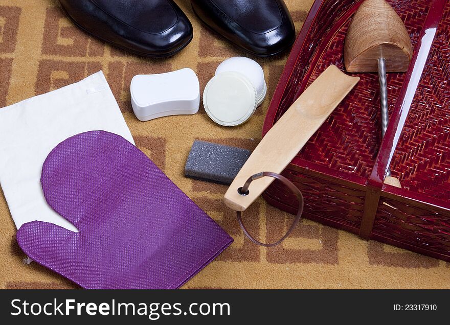 Shoe shine set for black and brown shoes over white background. Shoe shine set for black and brown shoes over white background