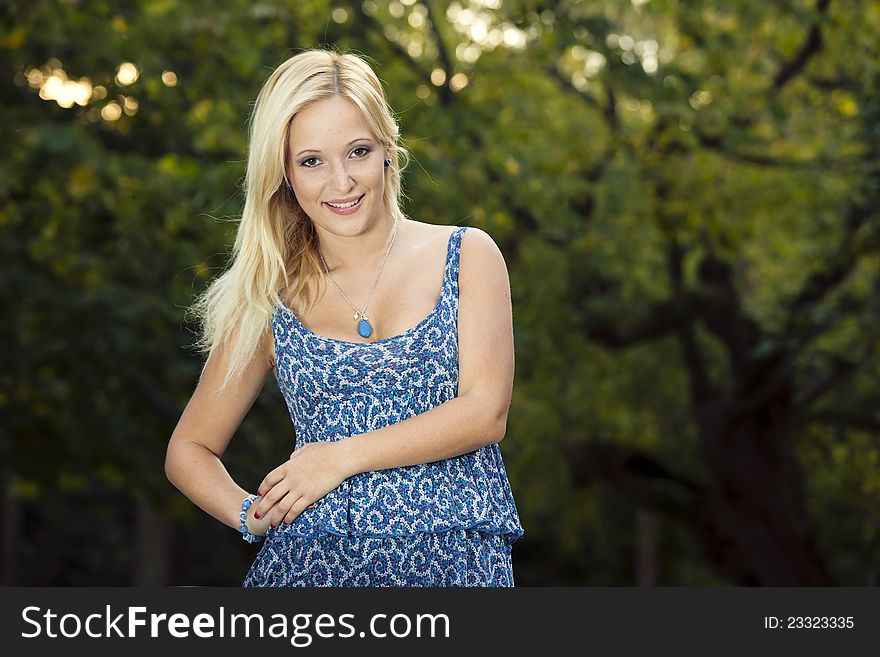 Outdoor portrait of a beautiful young girl smiling. Outdoor portrait of a beautiful young girl smiling