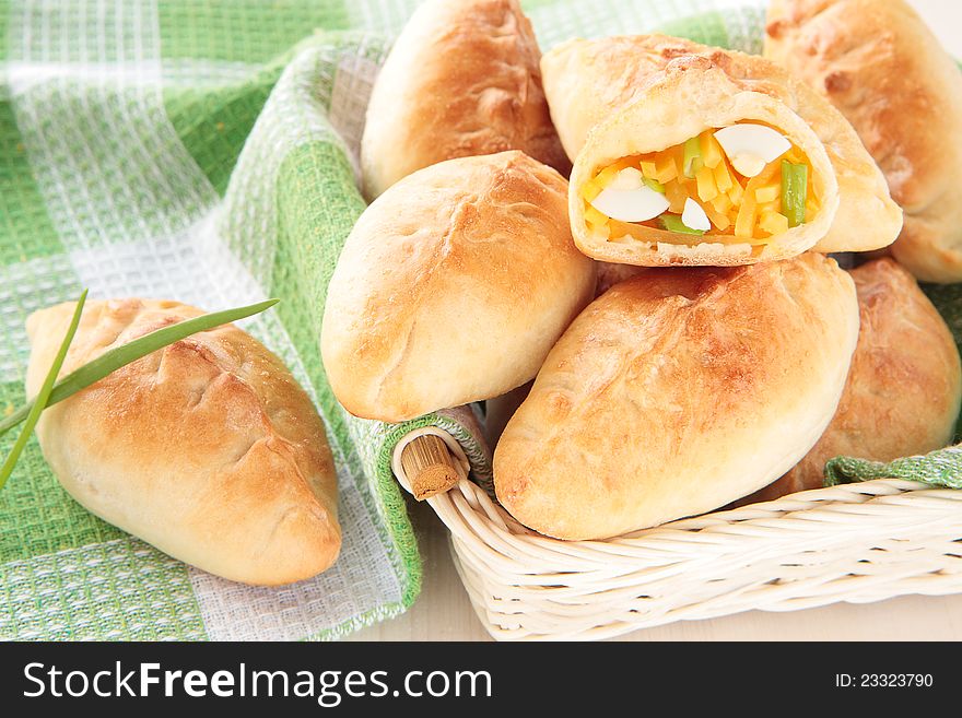 Baked patties with turnip, egg and green onions in a basket