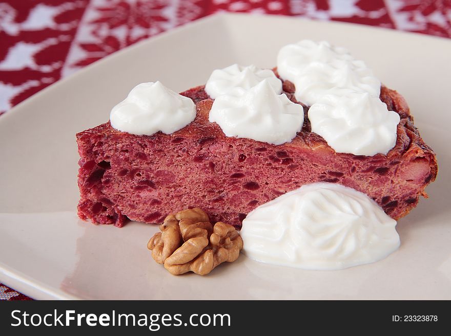 Baked pudding with beetroot, cheese, walnuts