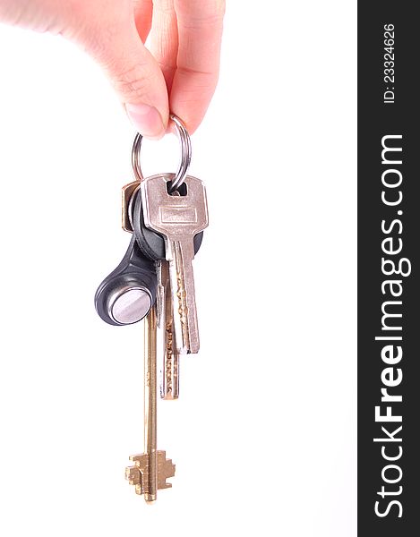 Bunch of keys in hand isolated on white background. Usual silver key, smart botton and old-fashioned long golden key. Bunch of keys in hand isolated on white background. Usual silver key, smart botton and old-fashioned long golden key.