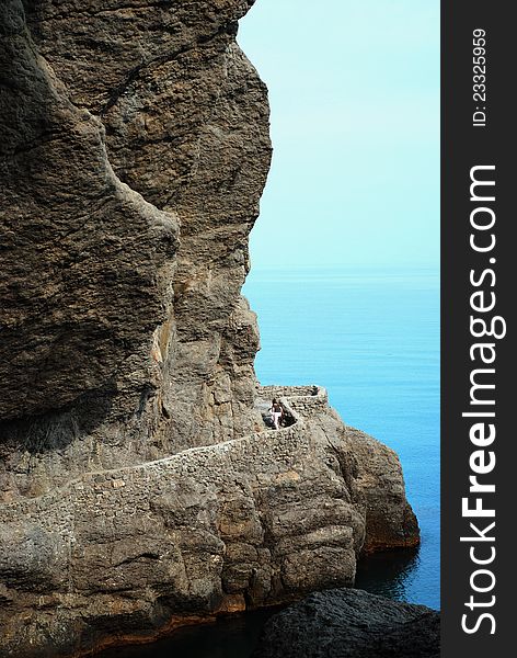 Pedestrian path, leading along with the steep coast round mountains. Pedestrian path, leading along with the steep coast round mountains.