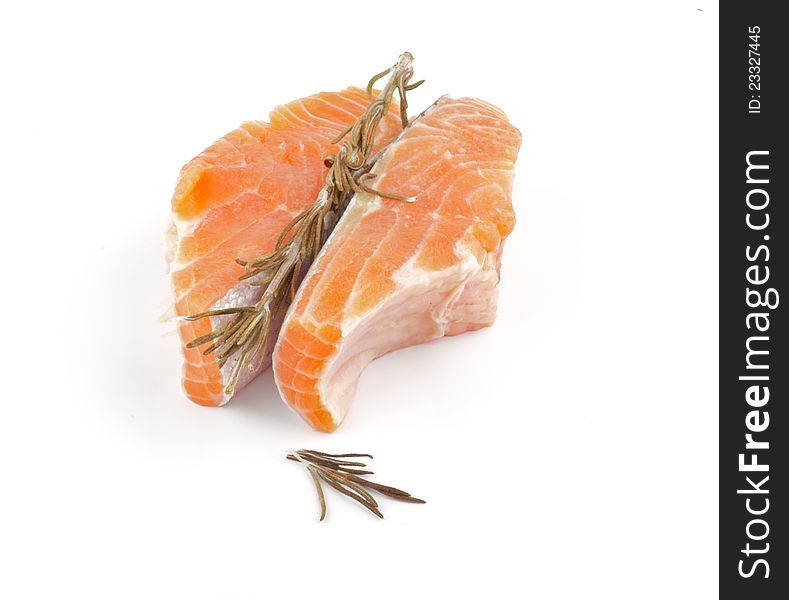 Raw Salmon Fish Fillet with rosemary isolated on white background
