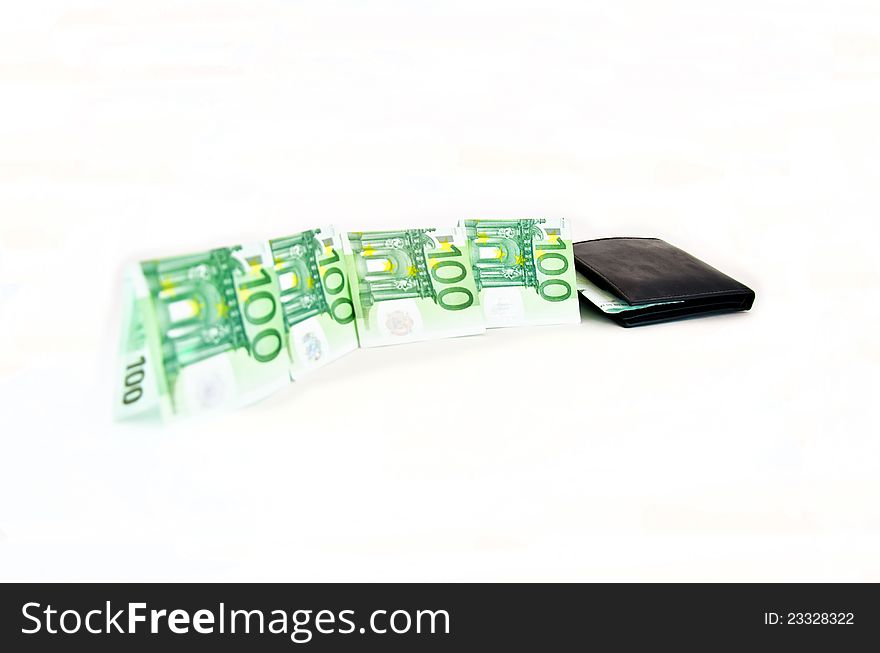 Money going into wallet isolated on white. Money going into wallet isolated on white