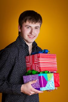 Present Gifts Holding Man Looking Camera Royalty Free Stock Photos
