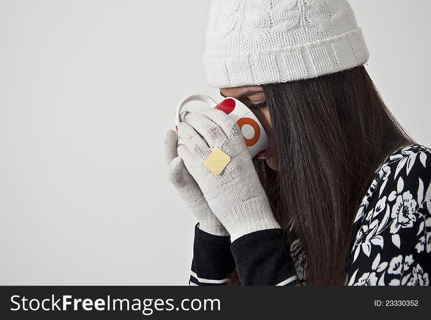 Beautiful young girl in winter clothes photographed in studio. Beautiful young girl in winter clothes photographed in studio