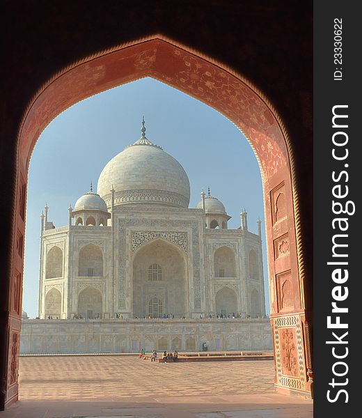 Taj Mahal as seen through arch of adjacent mosque, Agra, India