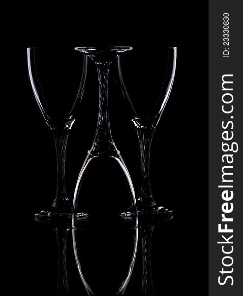 Composition from three glasses on a black background