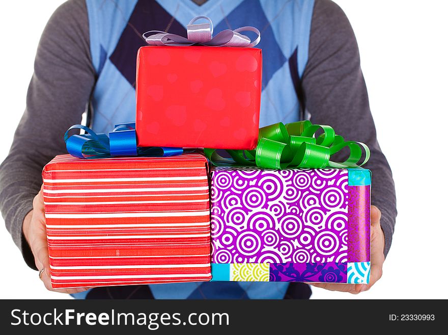 Present gift holding man looking camera. Present gift holding man looking camera