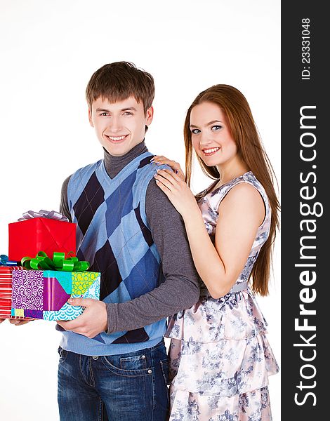 Young couple with gifts isolated