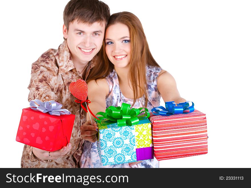 Young couple with gifts isolated