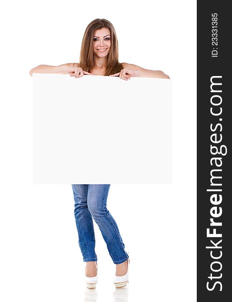 Happy young woman holding a blank billboard