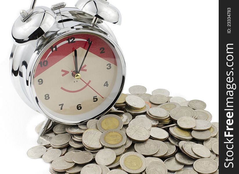 Alarm clock and Baht coins isolated on white background as banking concept. Alarm clock and Baht coins isolated on white background as banking concept.